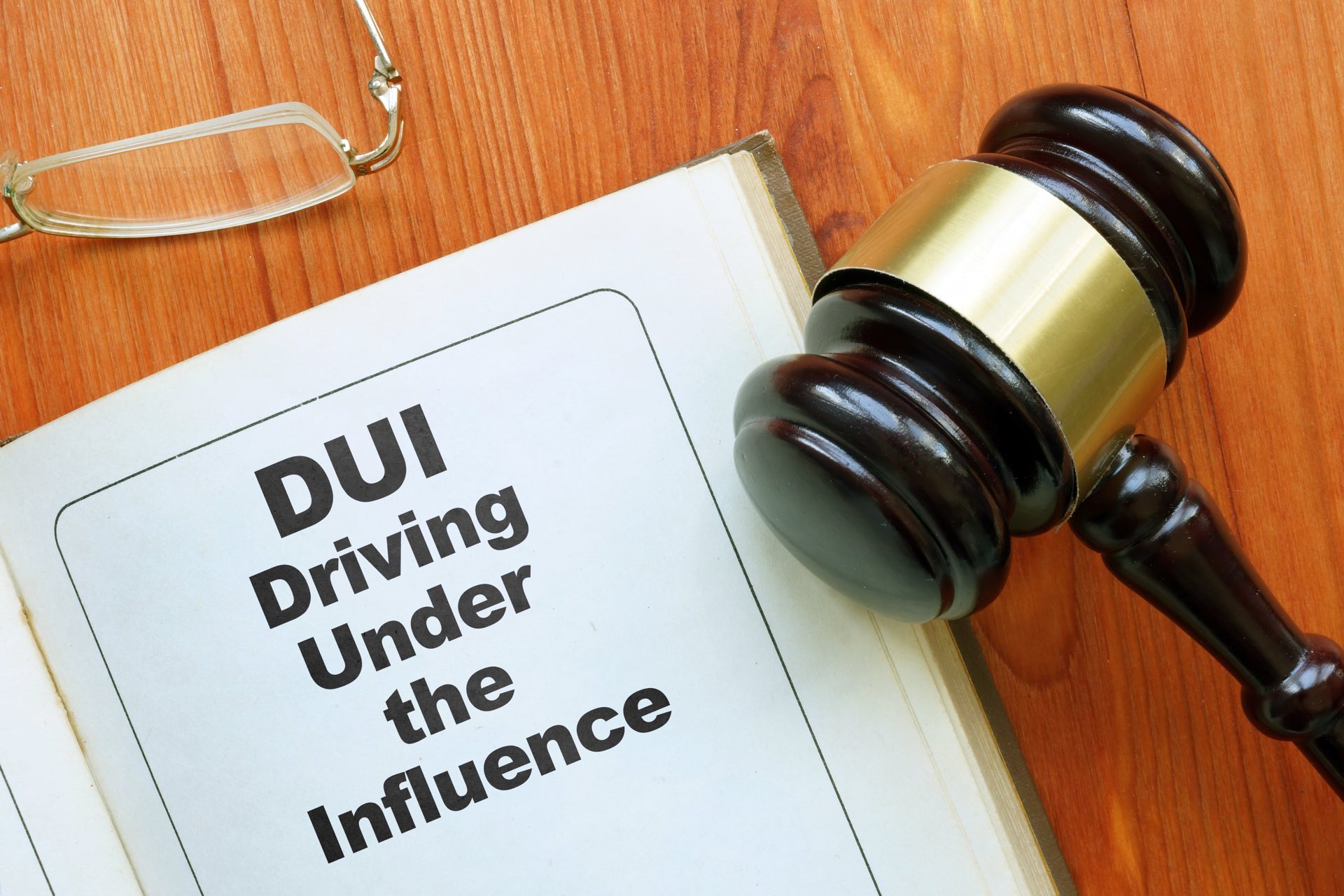 A gavel, next to paperwork that says DUI driving under the influence